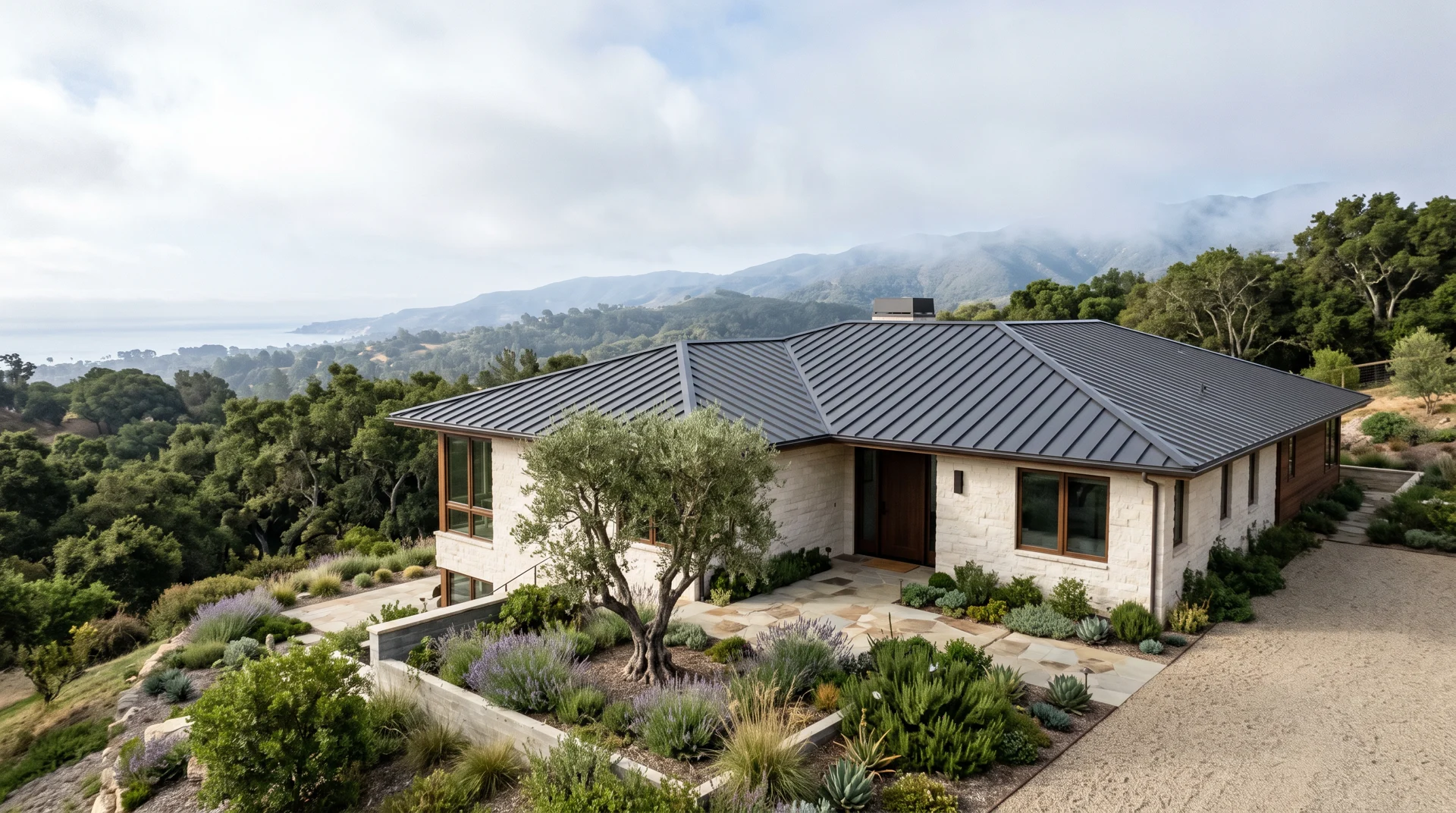 Illustrative charcoal standing-seam metal roof on a limestone home